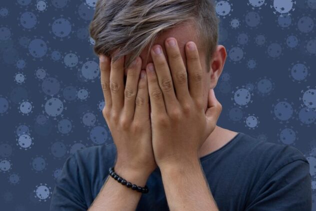 boy covering his face in shame