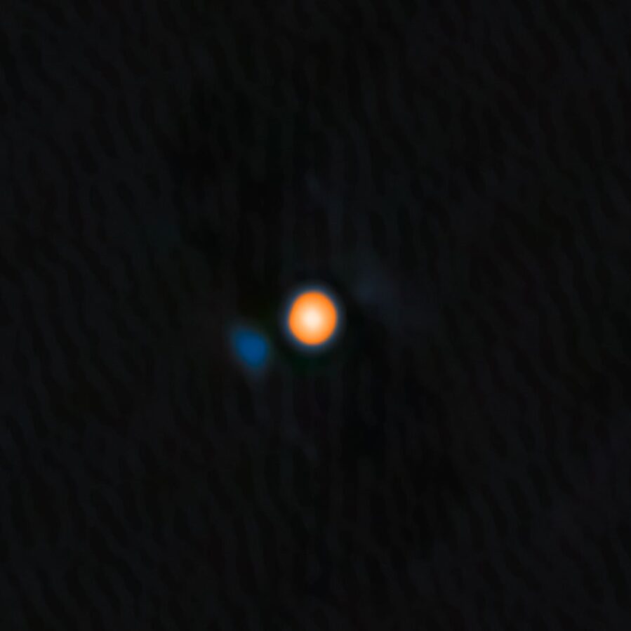 An image of Betelgeuse, the yellow-red star, and the signature of its close companion, the faint blue object. Credit: Data: NASA/JPL/NOIRlab. Visualization: NOIRLAB