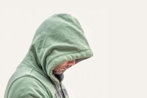 hooded man with hidden face