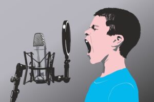boy singing into microphone