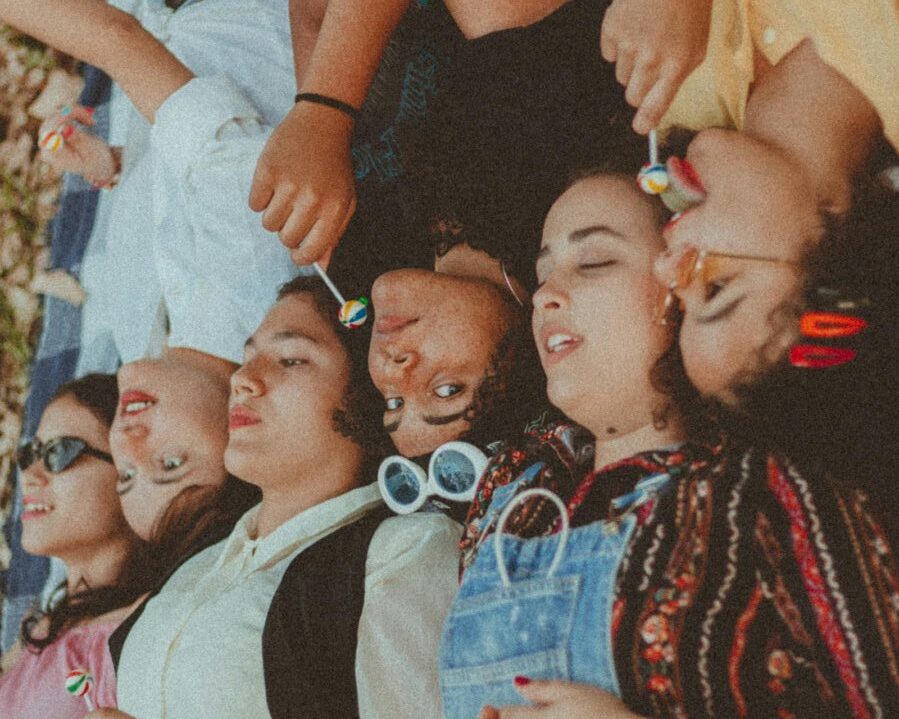 Girls lying on their backs in a row