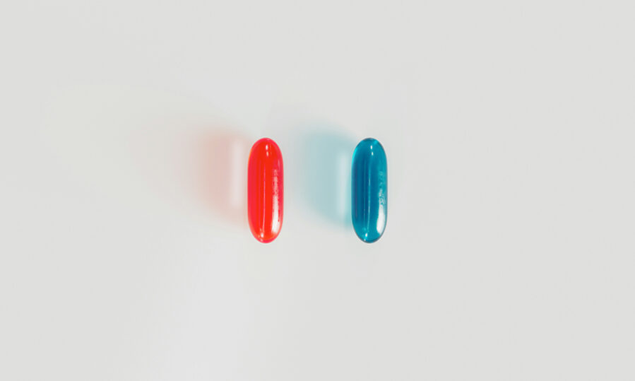In the film The Matrix, about a computer-simulated world, the red and blue pills symbolize a choice the hero must make between illusion and the truth of reality.