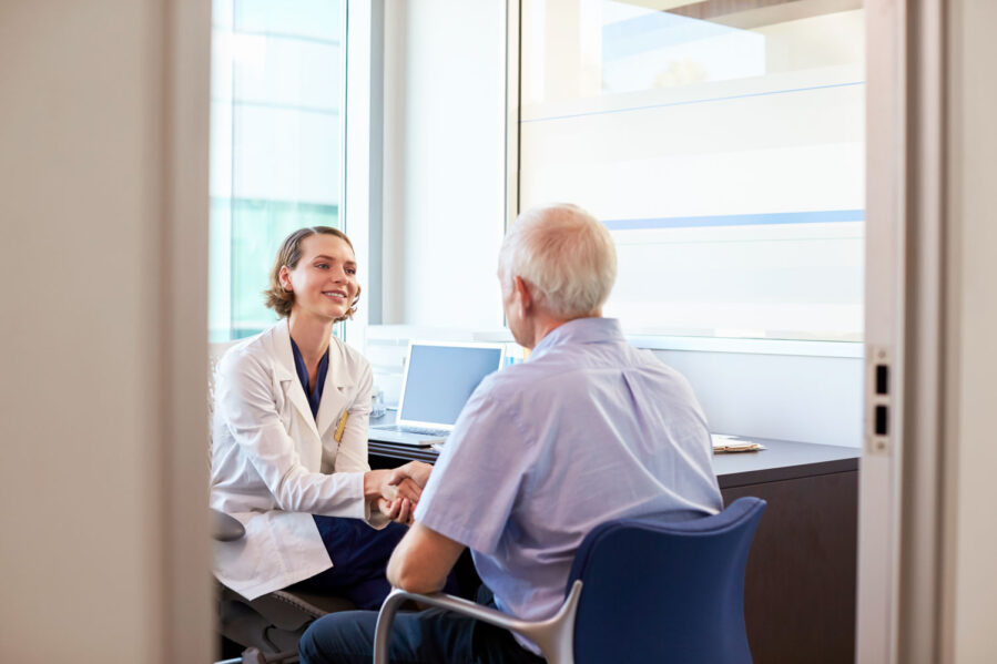 female doctor and elderly man