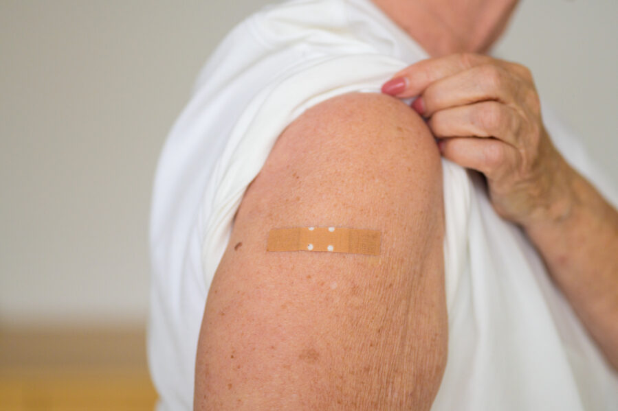 vaccinated arm with bandage