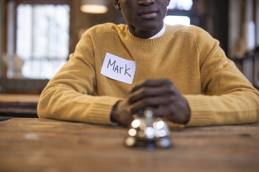 man with MARK name tag