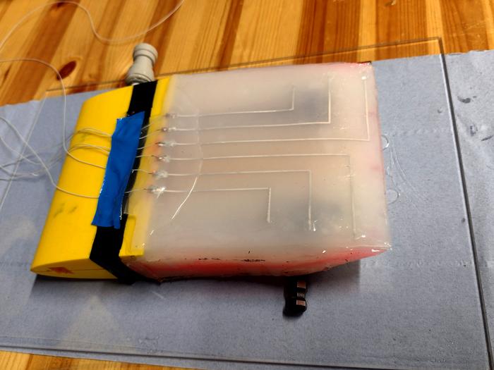 Liquid-Metal Skin Gives Robotic Underwater Wing Fish-Like Awareness of Currents