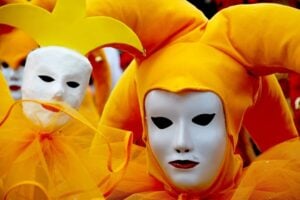 people wearing neutral theater masks