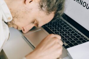 man asleep at keyboard