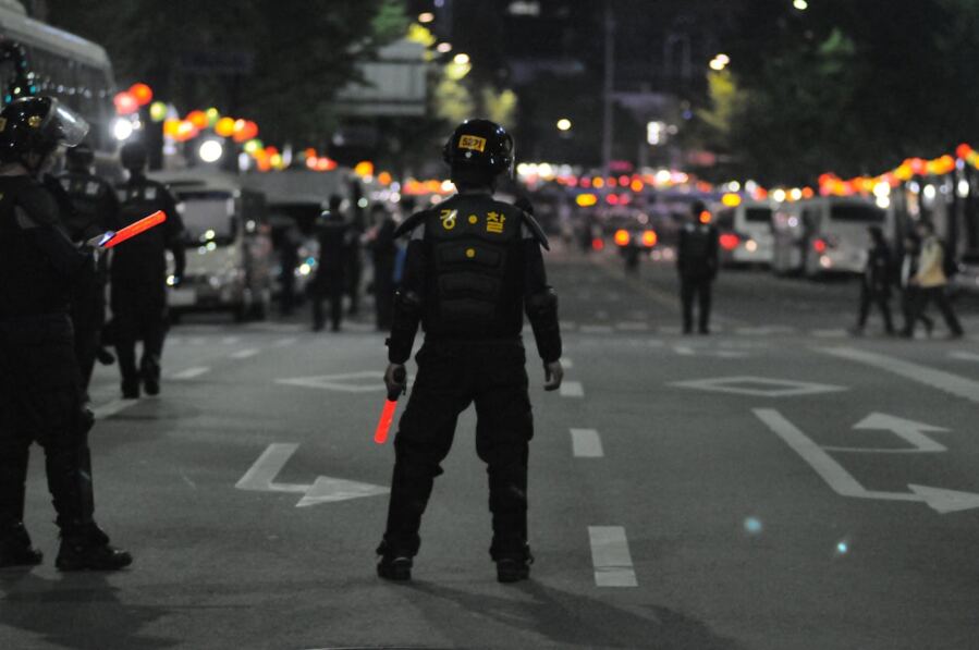 Police on street seen from behind