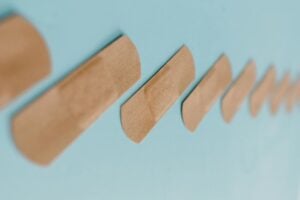 bandages on an aqua green background