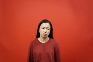 woman looking unhappy