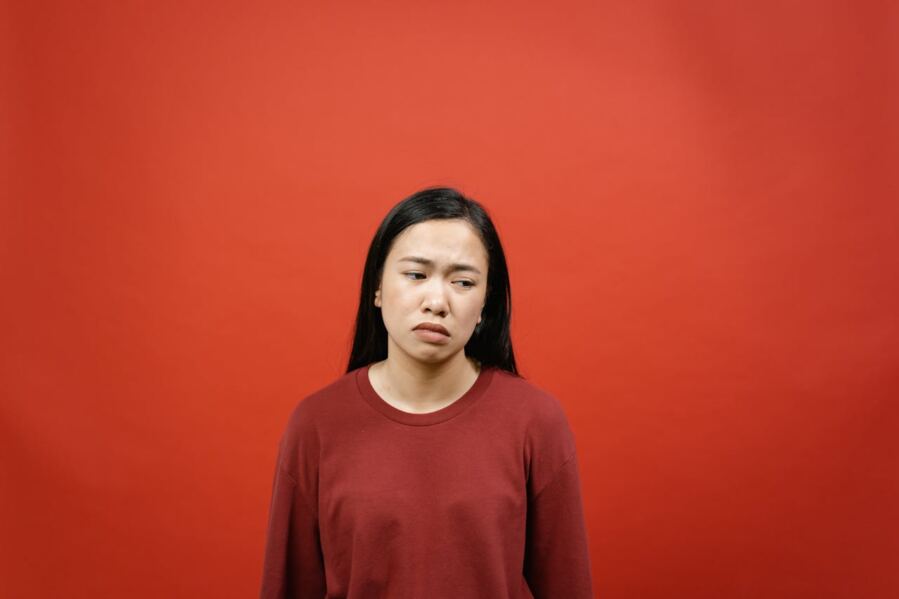 woman looking unhappy