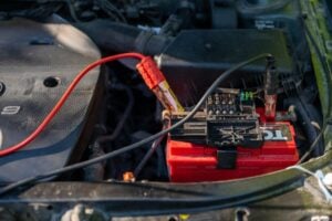 car battery attached to jumper cables