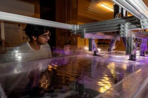 OIST PhD student Aditya Singh generates and observes surface waves that act as a classical analogue to quantum effects.