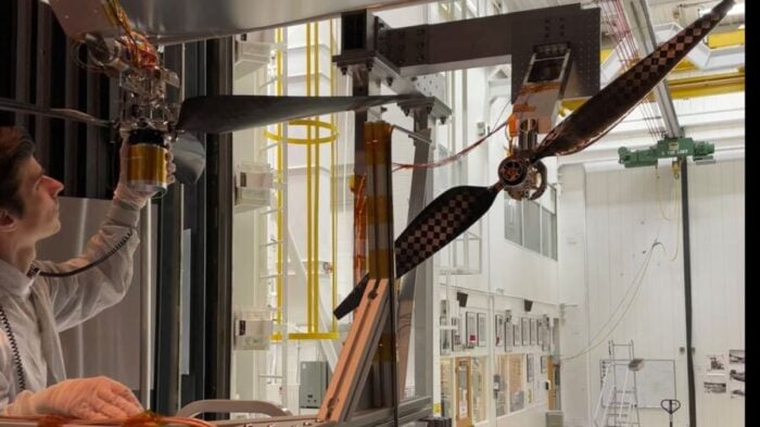 Engineer Jaakko Karras inspects a next-generation Mars helicopter rotor blade prior to testing it at supersonic speeds in the 25-Foot Space Simulator at NASA’s Jet Propulsion Laboratory in November 2025.