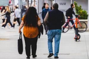 overweight couple walking