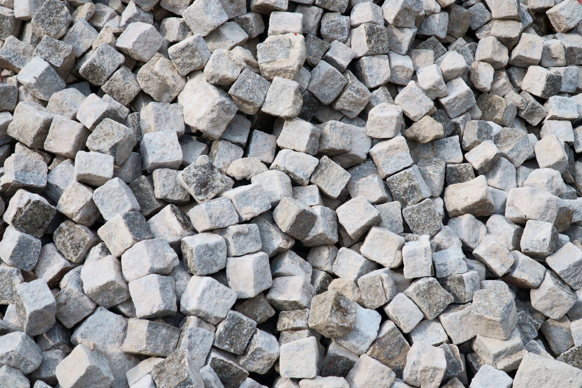 Heap of gray stone cubes ideal for construction projects and landscaping designs.
