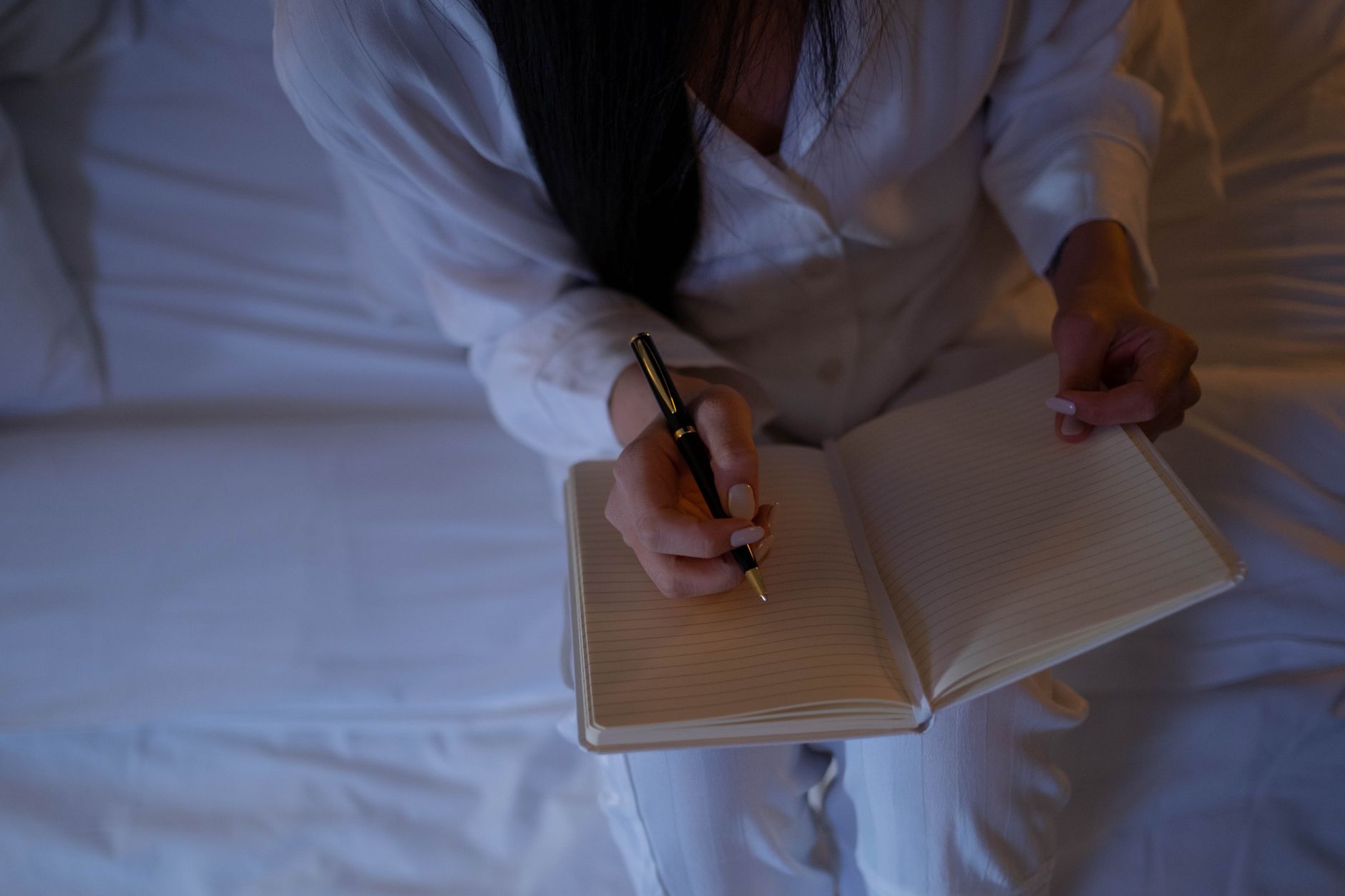 Representative person writing privately in a notebook