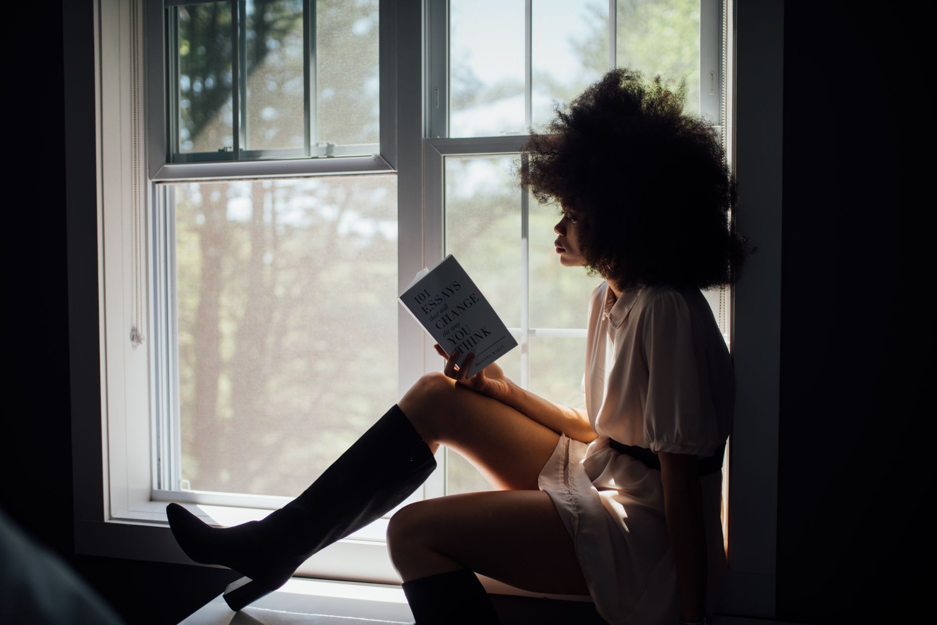 Representative person reading alone in a quiet room