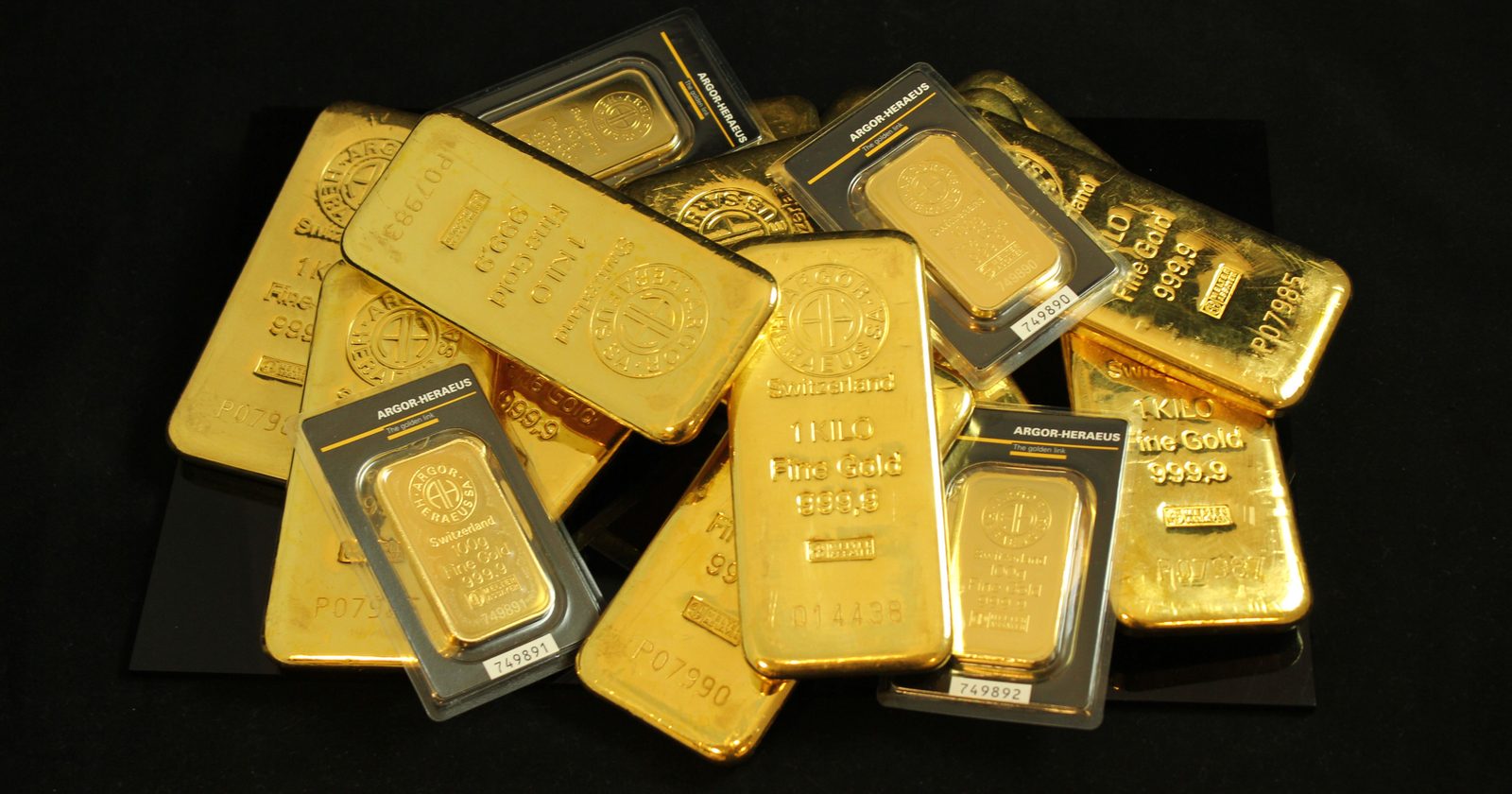A collection of precious gold bars stacked elegantly, symbolizing wealth and prosperity.