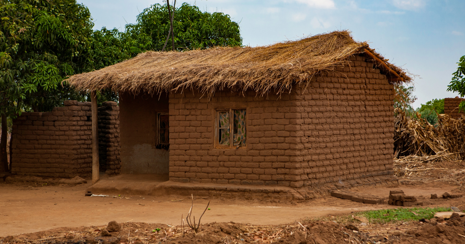 Rural electricity access in Malawi was about 2% in 2002, and a 14-year-old sent home from school over $80 in fees built a 5-metre tower from blue gum poles, a broken bicycle and a tractor fan — the dynamo lit four bulbs and two radios, and neighbours queued to charge phones