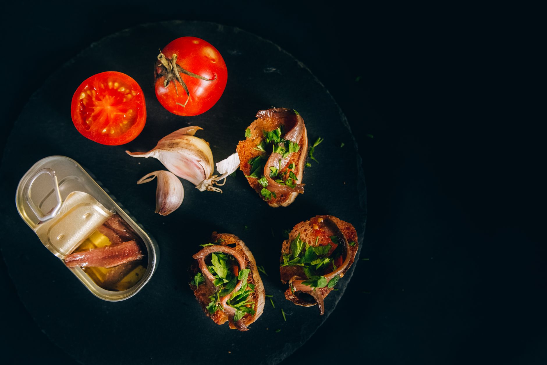 Anchovies and tomato on toast, a strongly flavored combo