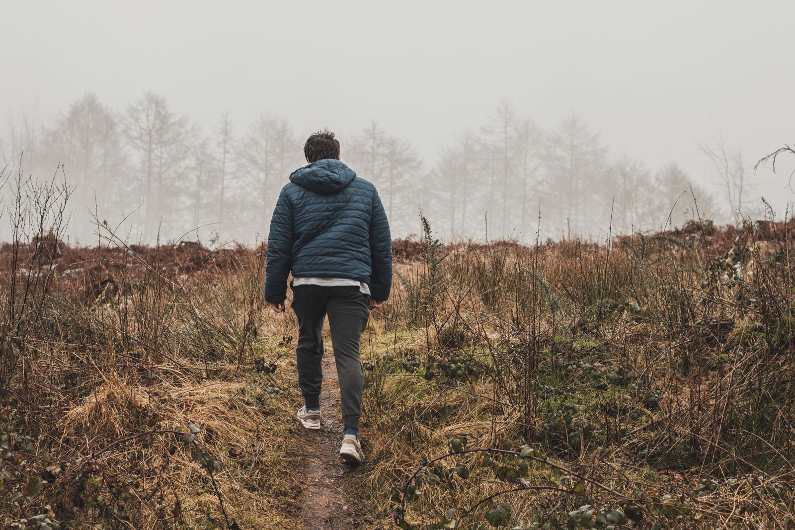 person walking outdoors alone
