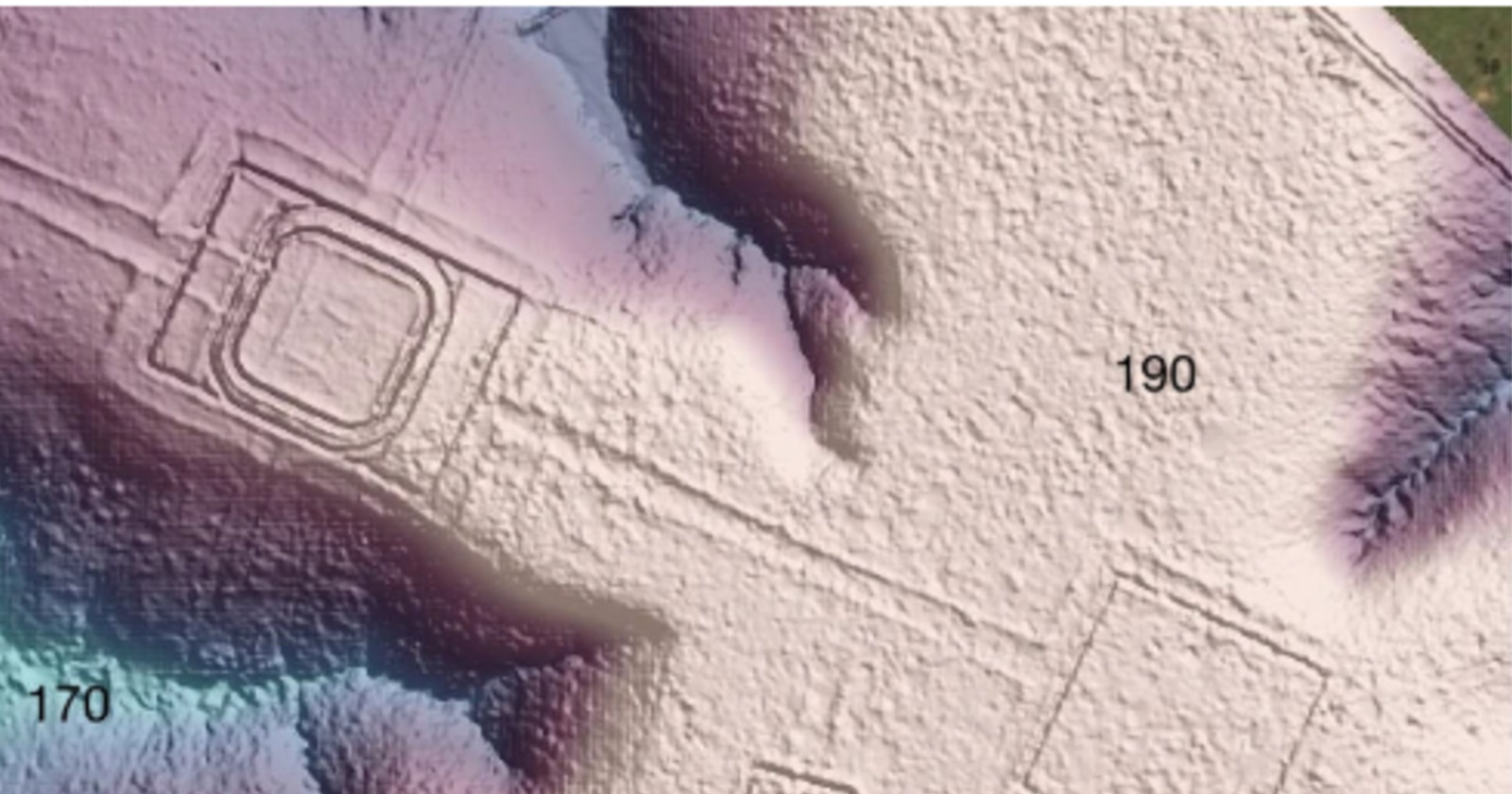 Laser-derived hillshade terrain model showing a square ditched enclosure and linear embankments beside a dark river valley in southwest Amazonia