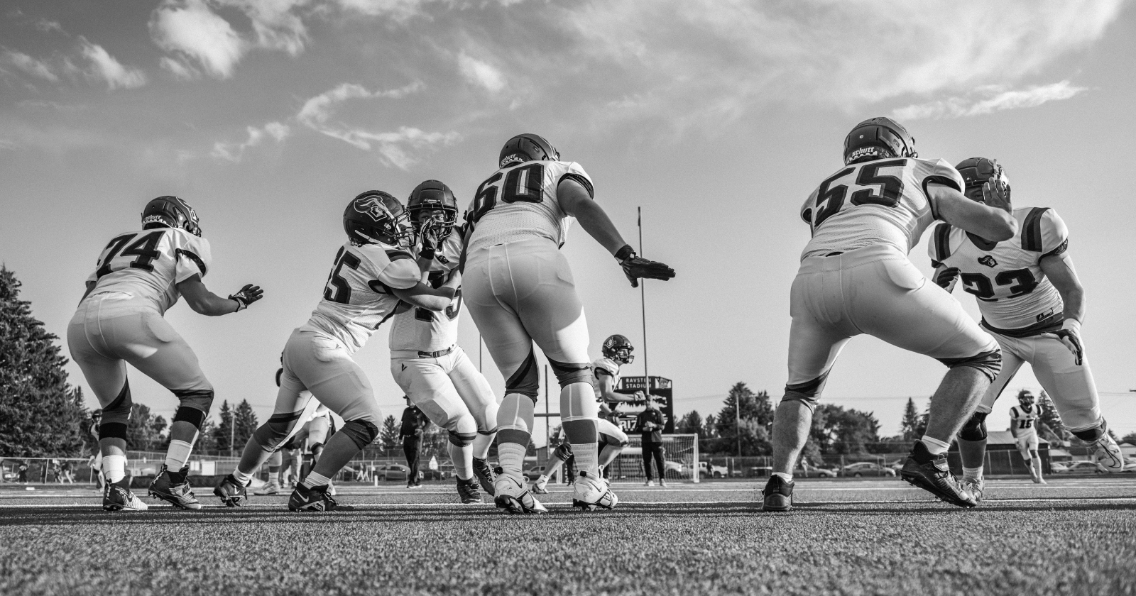 American football players lined up before a play