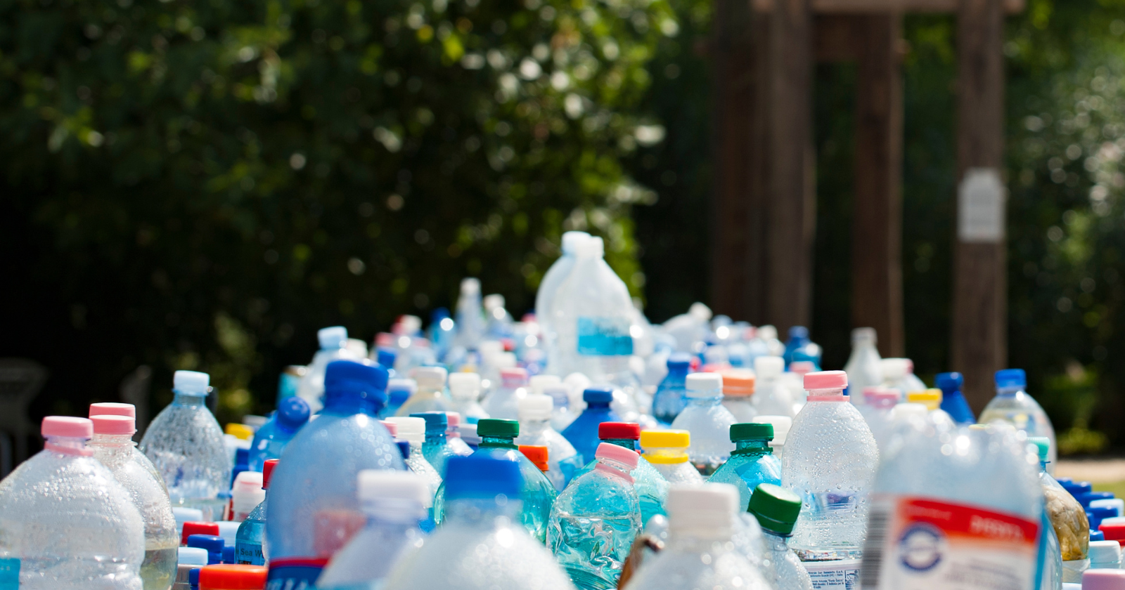 Pile of discarded plastic bottles outdoors