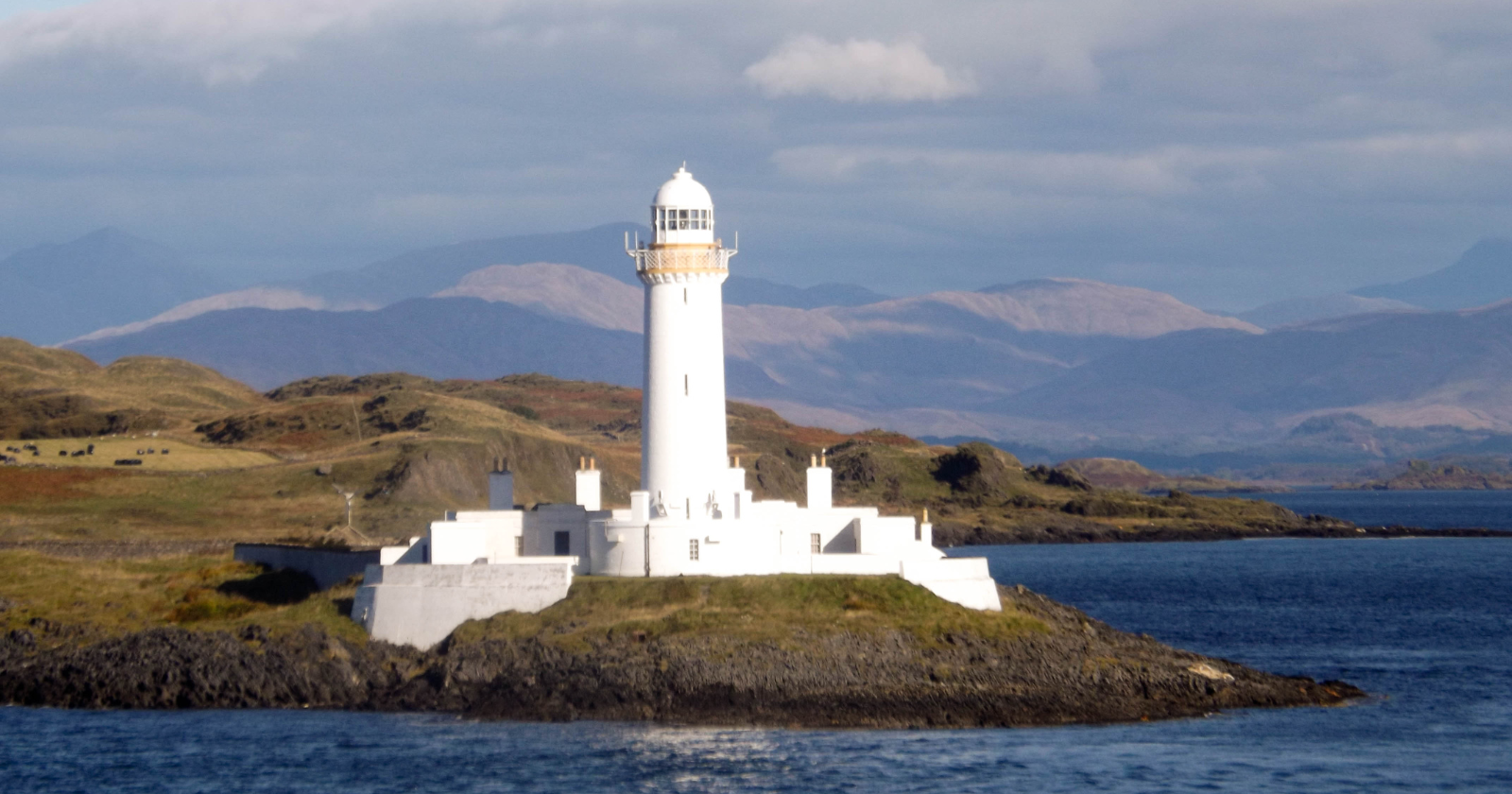 White lighthouse on a rocky coast