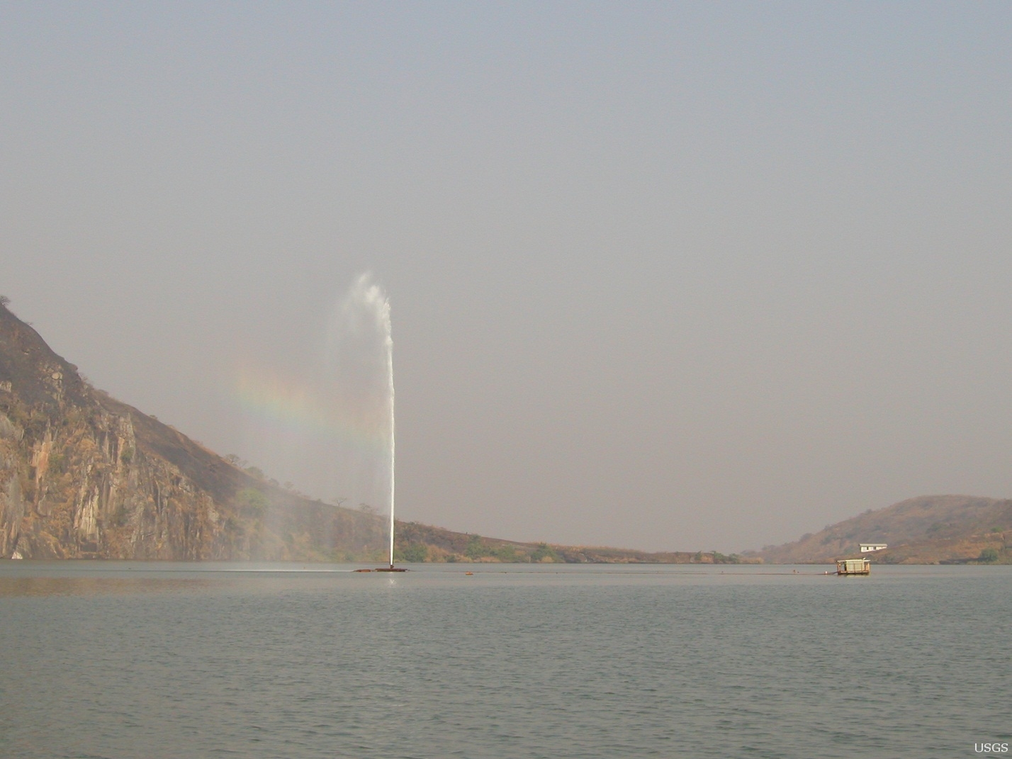 Lake Nyos degassing pipe fountain in operation, Cameroon — USGS public domain (Bill Evans)