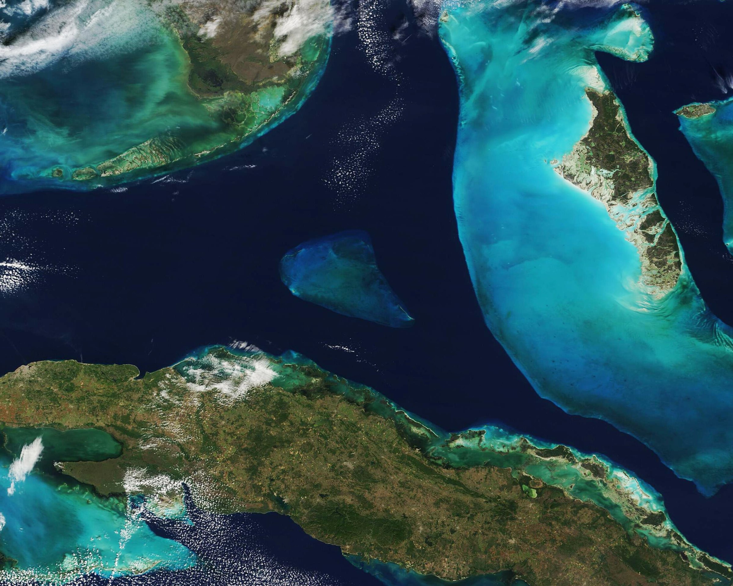 Satellite view of the deep blue Florida Straits between the turquoise shallows of Florida, the Bahamas and Cuba