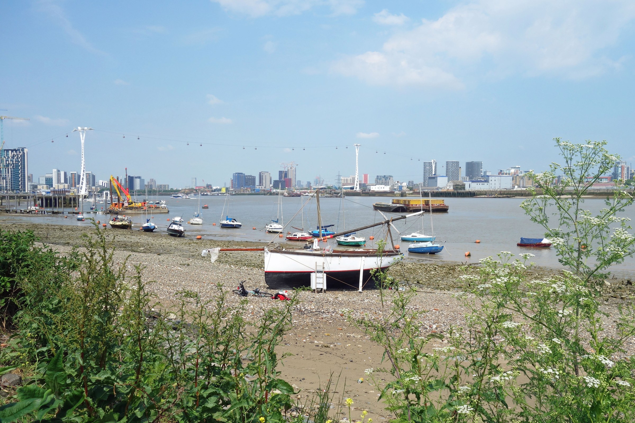 Boats on the foreshore of the Tidal Thames at low tide at Bugsby's Reach, Greenwich